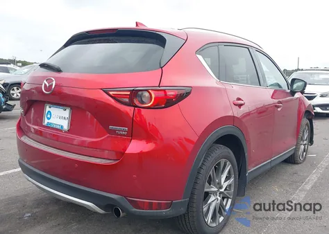 2021 Mazda Cx-5 Signature z USA, uszkodzony, nr VIN JM3KFBEY6M0430937
